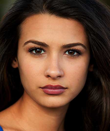 Latina wearing Miami Sunset Breeze lipstick by Plum & York, pink lipstick for olive skin