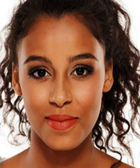 African-American woman wearing African Safari So Kissable Lipstick from Plum & York
