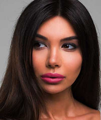 Latina wearing Brazilian Carnaval lipstick by Plum & York