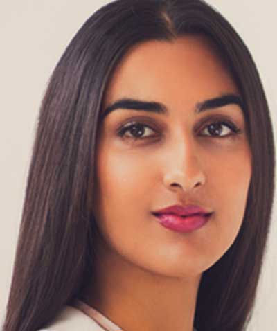 Indian woman wearing London Primrose Petals lipstick by Plum & York, makeup for brown skin
